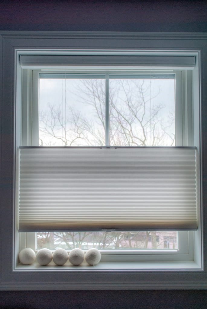 This the window in my laundry room. My husband put the dryer balls up on the sill to keep them from rolling around the room and I liked the contrast between the lines of the shade and window  and the fuzzy roundness of the balls. Did lots of editing - highlights, shadows, reduced the clarity a bit to make it look a little more ethereal.  If I were allowed to crop this, I would have shot a little wider and cropped off the top and bottom to leave just the window and frame.