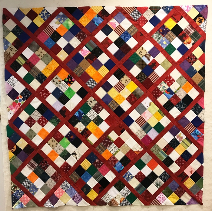 Scrap quilt, on-point postage stamp blocks