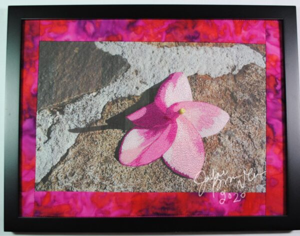 pink flower on stone thread painting
