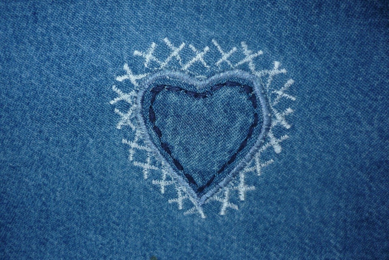 heart shaped mending stitches on denim