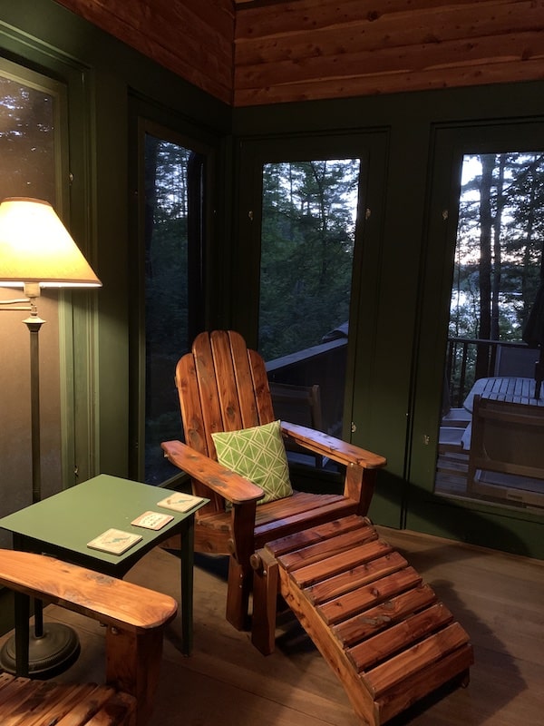 cedar adirondack chair on screen porch