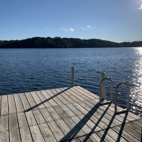 dock in a mountain lake on a summer day